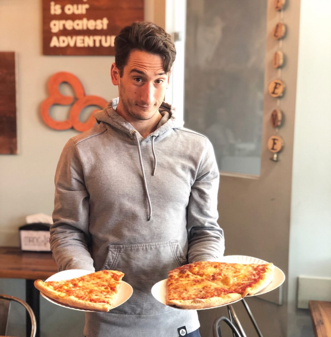 Mike Simone holding his pizza cheat meal
